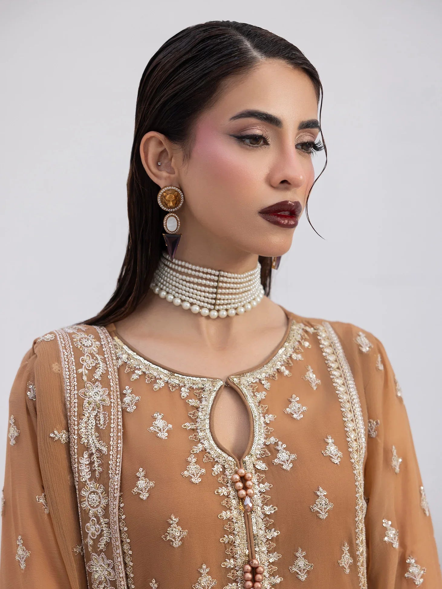 "Close-up detailing on the Gulaal Mirage shirt bodice, displaying fine threadwork embroidery, delicate sequin accents, and soft fabric texture."