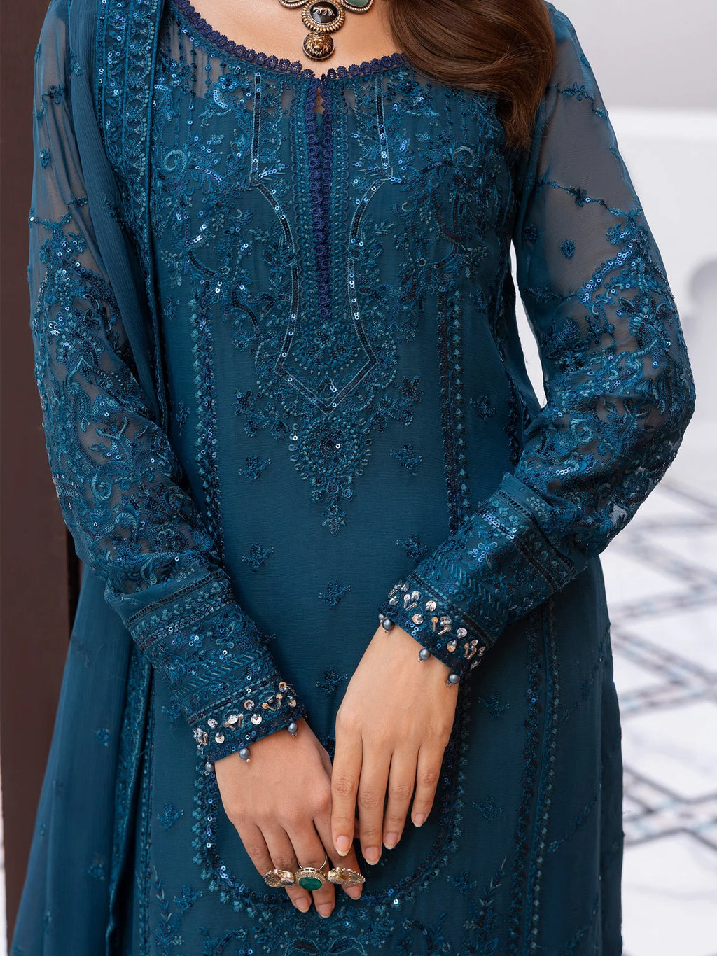 "Close-up detailing on the Gulaal Mist shirt bodice, displaying fine threadwork embroidery, delicate sequin accents, and soft fabric texture."