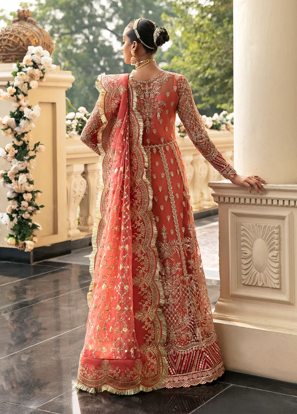 "Focus on the intricate sleeve cuff trimmings and embroidered hemline cutwork border details of the Gulaal Nehir stitched luxury suit, showing boutique-quality tailoring."