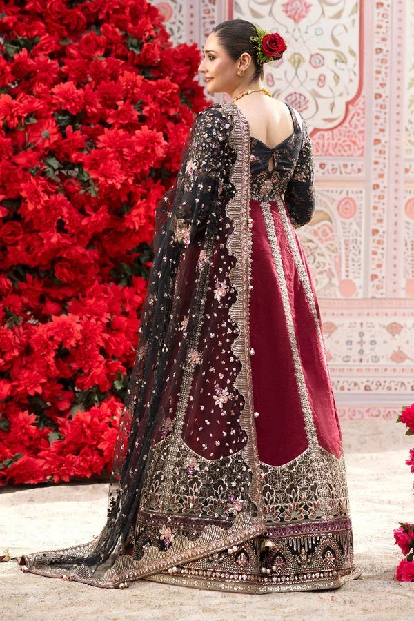 "Detailed view of intricate embroidered borders, cutwork daman finishing, and heavy embellishments on Nureh Emara formal suit."