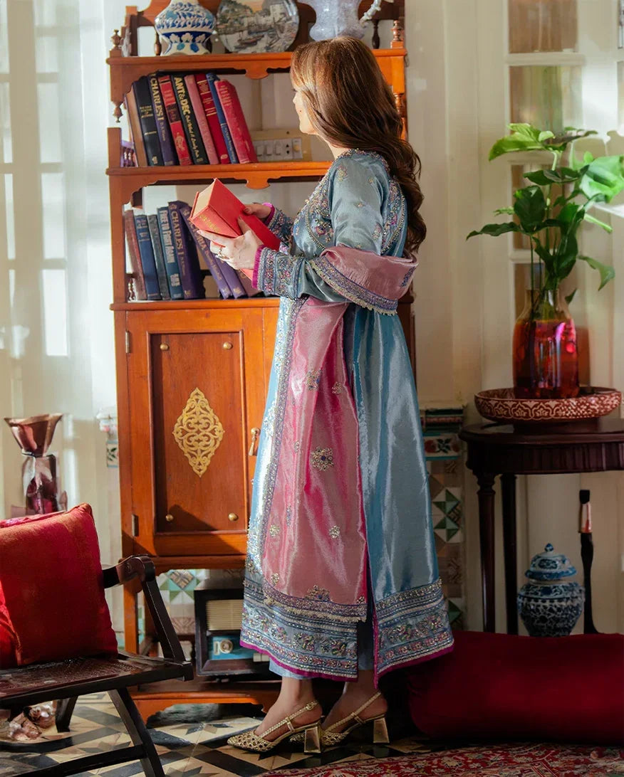 "Focus on the classic jamawar trouser weave and embroidered sleeve cuff trimmings of the Mushq Neelam luxury suit, showing boutique-quality tailoring."