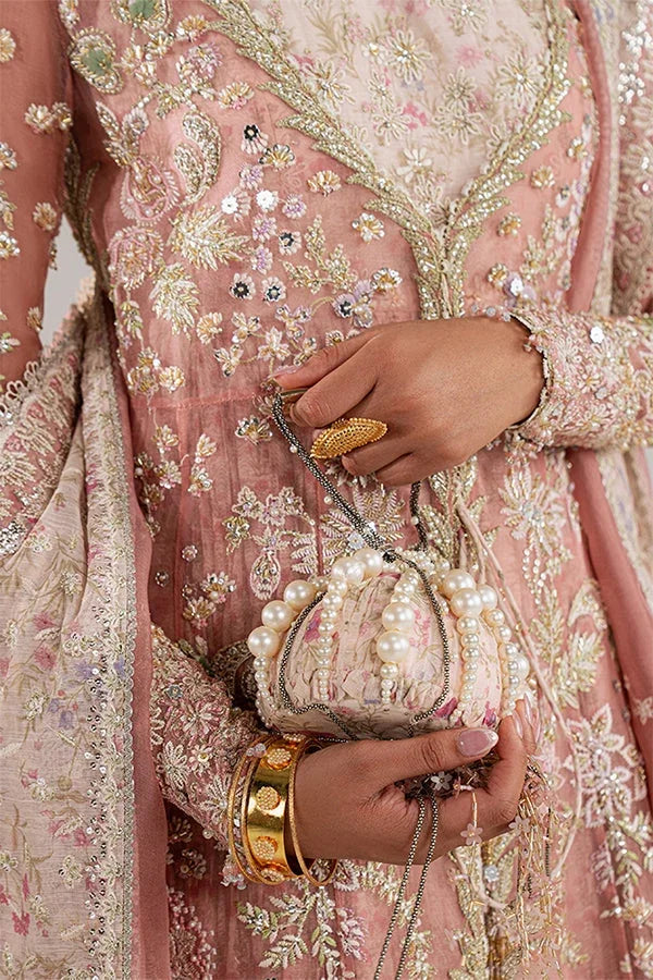 "Close-up of hand-worked zardozi, sparkling sequin accents, and fine resham threadwork embroidery on Suffuse Novara shirt bodice."