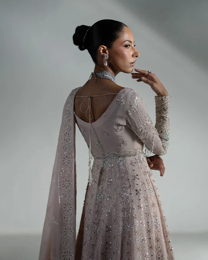 "Focus on matching embellished net dupatta drape and sleeve border details of the Vera nude pink kalidaar bridal suit."