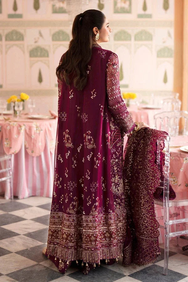 "Detailed view of intricate embroidered borders, cutwork daman finishing, and heavy embellishments on Nureh Nur formal suit."