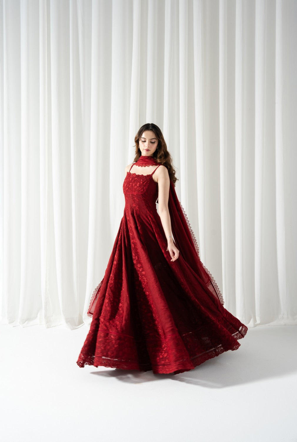 "Mirha Collections LXM Red Cotton Net Kalidaar stitched three-piece suit. Full-length flared frock view with all-over floral embroidery, silk dupatta, and straight trousers."