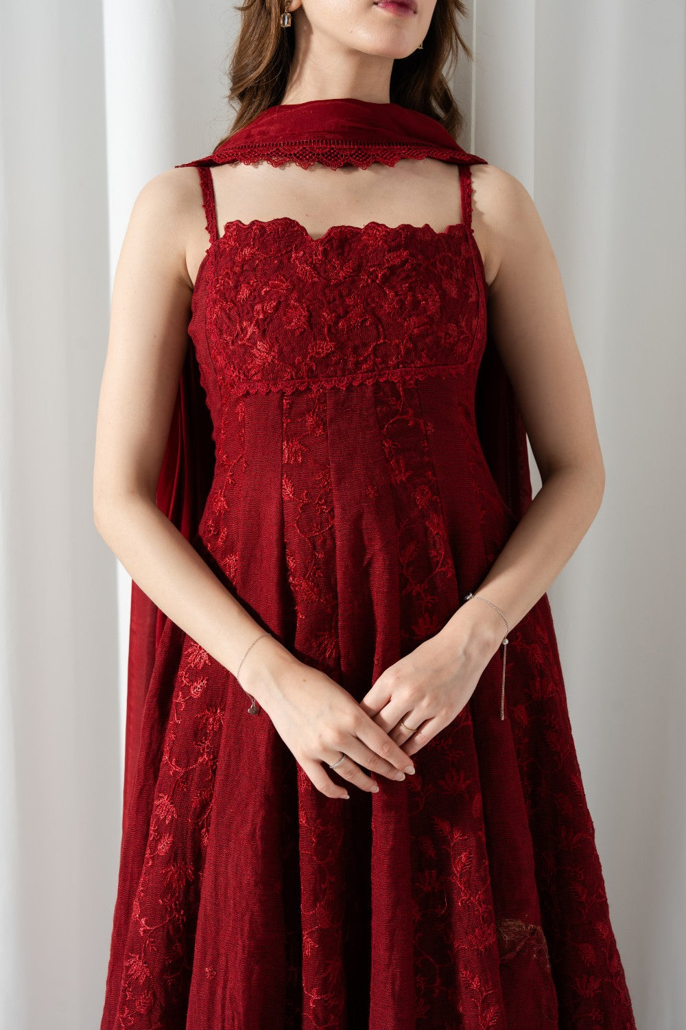 "Close-up detailing on the LXM Red Cotton Net Kalidaar bodice, displaying intricate all-over floral threadwork embroidery and soft cotton net texture."