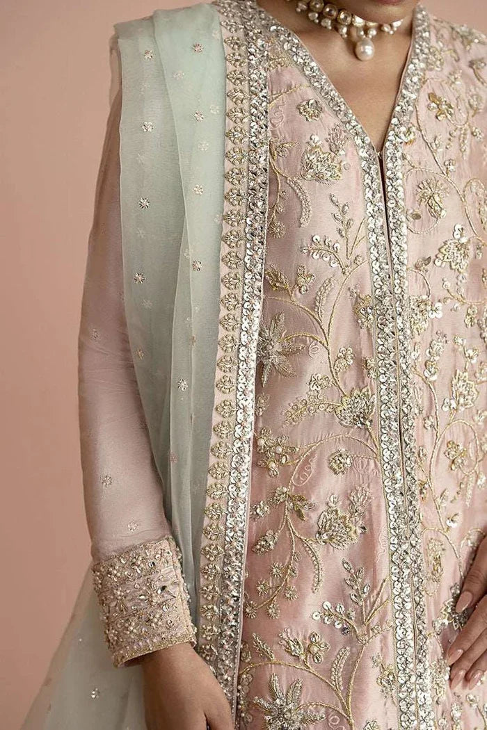 "Close-up detailing on the Vera pink shirt bodice featuring delicate hand-worked zardozi, crystals, and sequin embroidery."