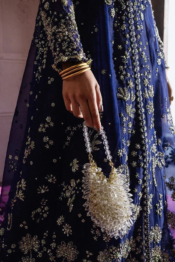 "Detailed view of intricate embroidered organza borders and embellishments on the hemline of Suffuse Rishaal wedding formal."