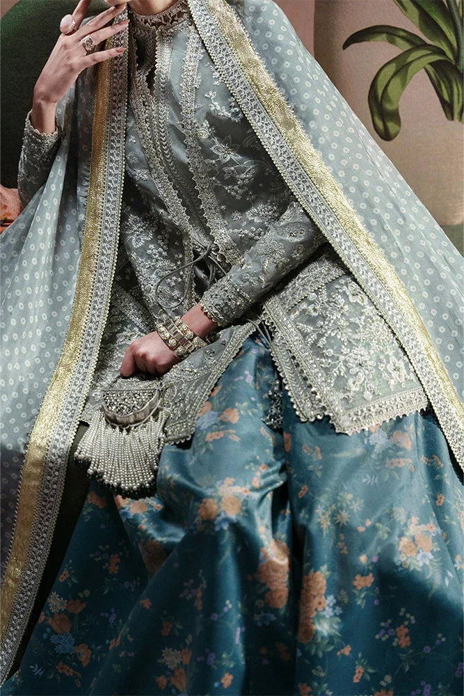 "Close-up of delicate resham threadwork, lace inserts, and hand-embellished accents on the Suffuse Selineh silk shirt neckline."