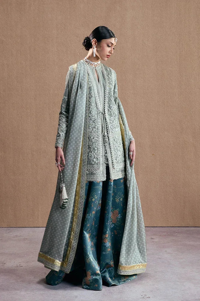 "Detailed view of sleeve border trim and hemline finishing details on the Suffuse Selineh silk pret outfit."