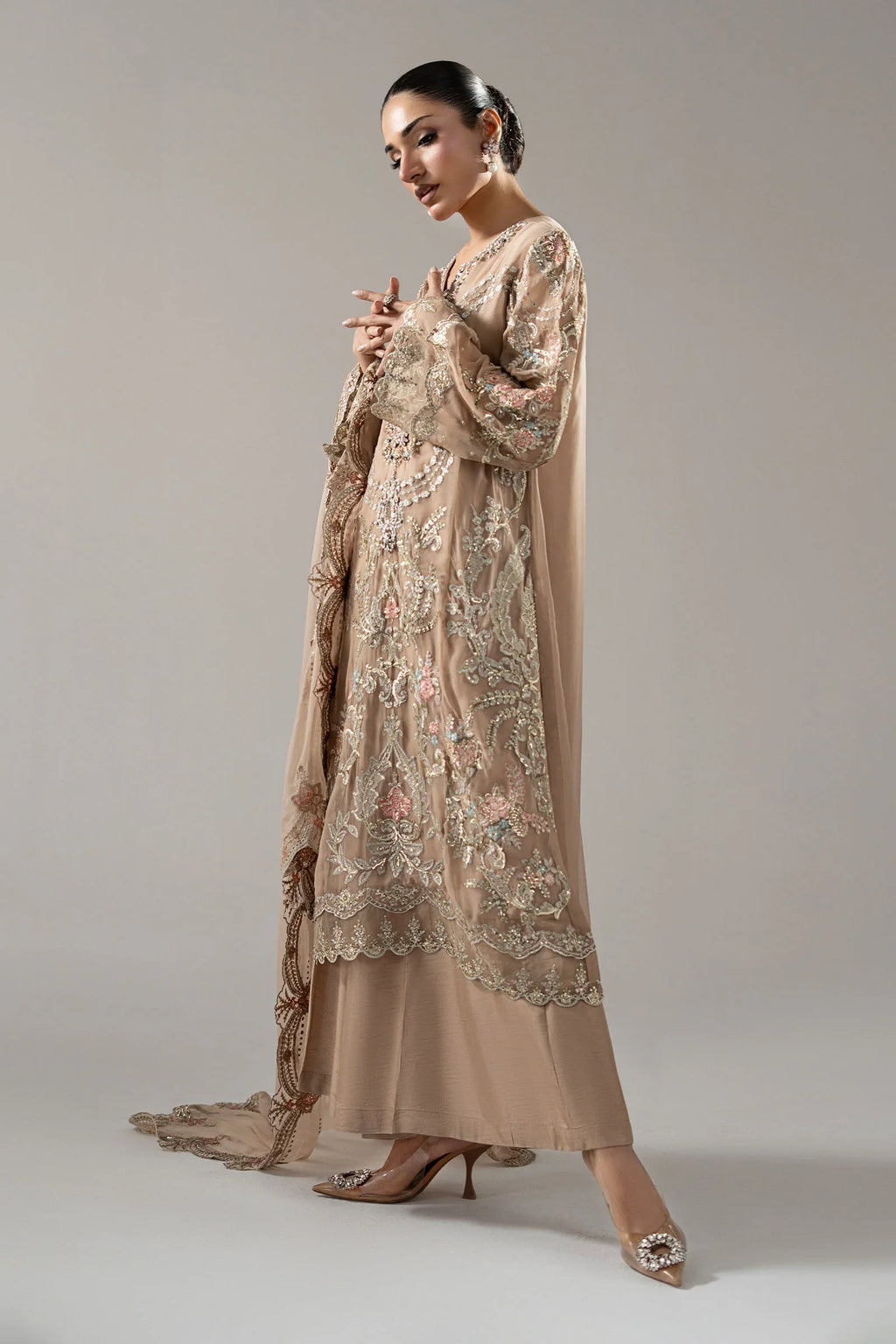 "Focus on the traditional raw silk Dhaka trousers and scalloped sleeve border details of the Maria B SF-EA25-18R1 Skin stitched luxury formal suit."