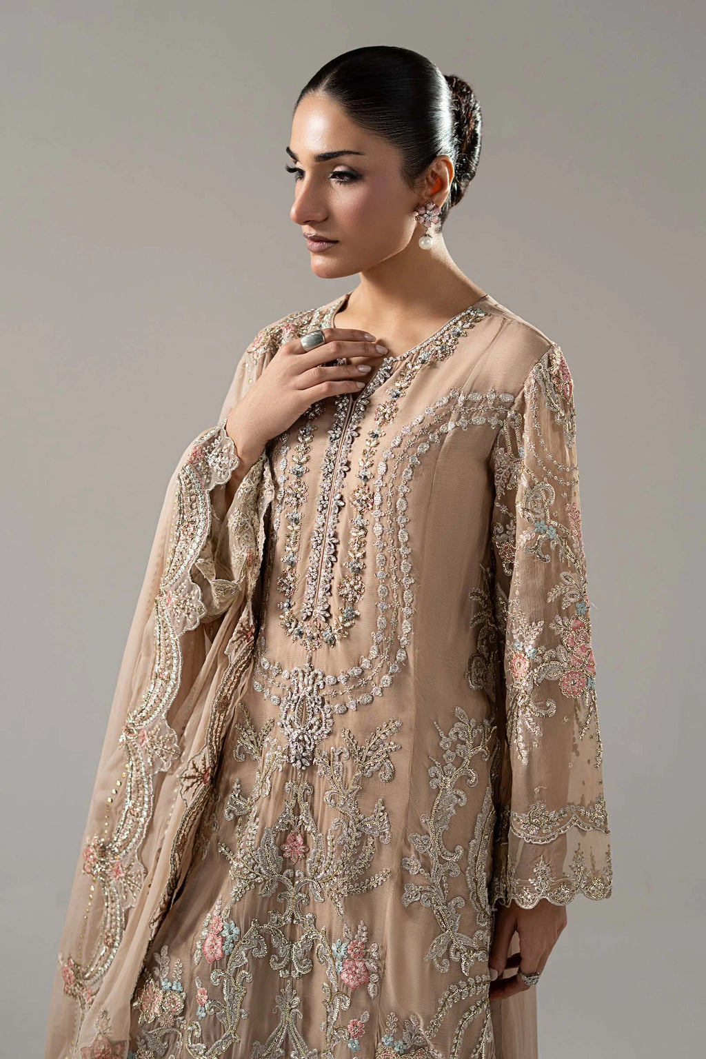 "Close-up detailing on the Maria B SF-EA25-18R1 Skin shirt bodice, displaying hand-embellished V-neckline with delicate sequin, tilla, and threadwork embroidery."