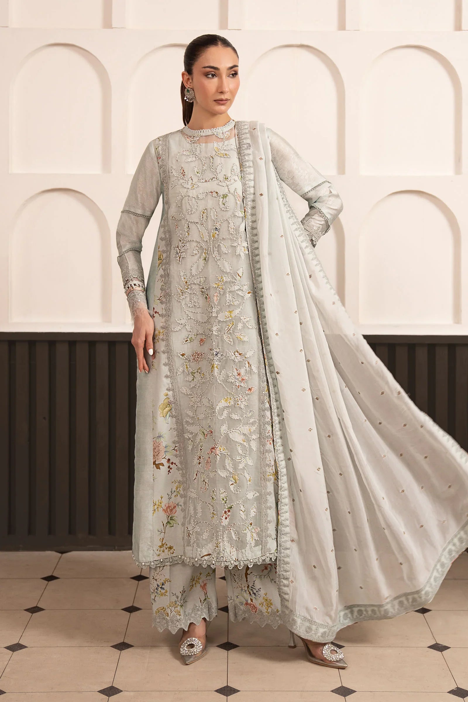 "Mirha Collections Maria B SF-EA26-24 ice blue 3-piece embroidered raw silk suit. Full-length front view featuring tailored shirt, medium silk dupatta, and printed raw silk culottes."