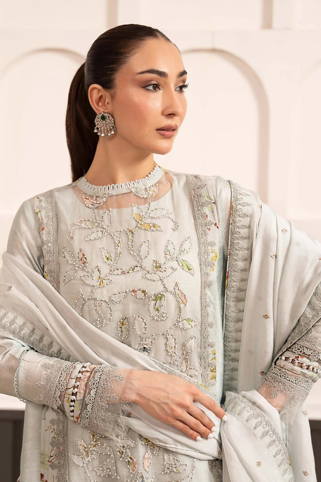 "Close-up detailing on the Maria B SF-EA26-24 Ice Blue shirt bodice, displaying hand-embellished Kavya embroidered organza detailing, fabric-loops, and lace accents."