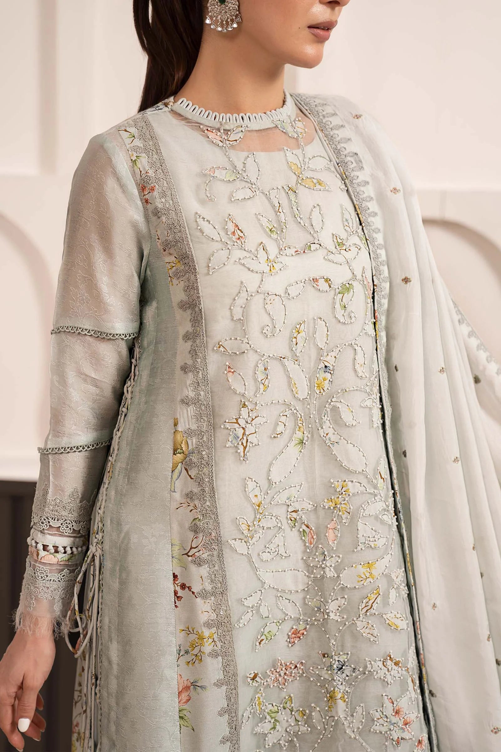 "Focus on the printed raw silk culotte trouser with embroidered hem border details and sleeve cuff trimmings of the Maria B SF-EA26-24 stitched luxury suit."