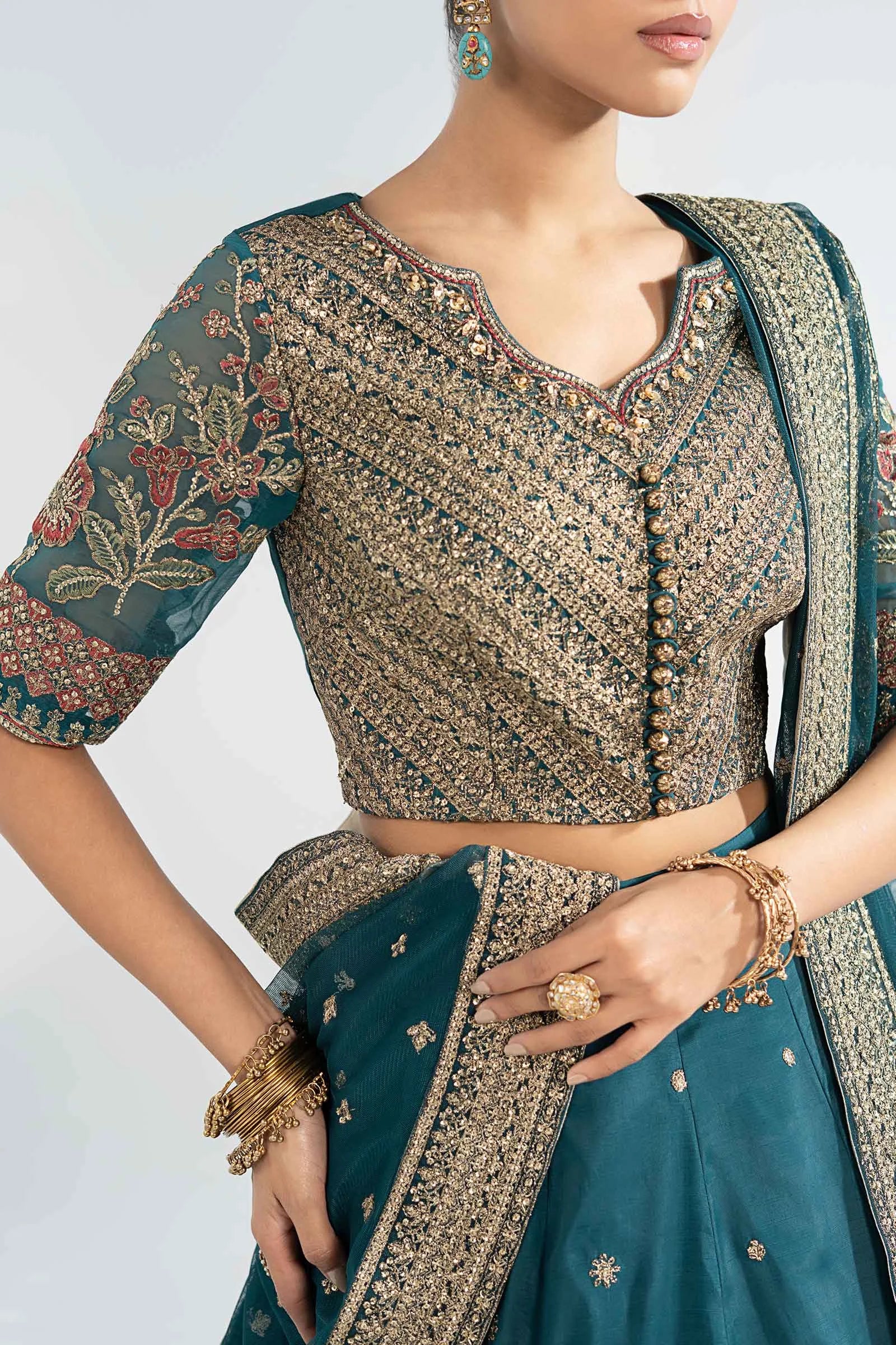 "Close-up detailing on the Maria B SF-EA26-27 Teal shirt bodice, displaying hand-worked adda embellishments, sparkling sequin accents, and fine silk fabric texture."