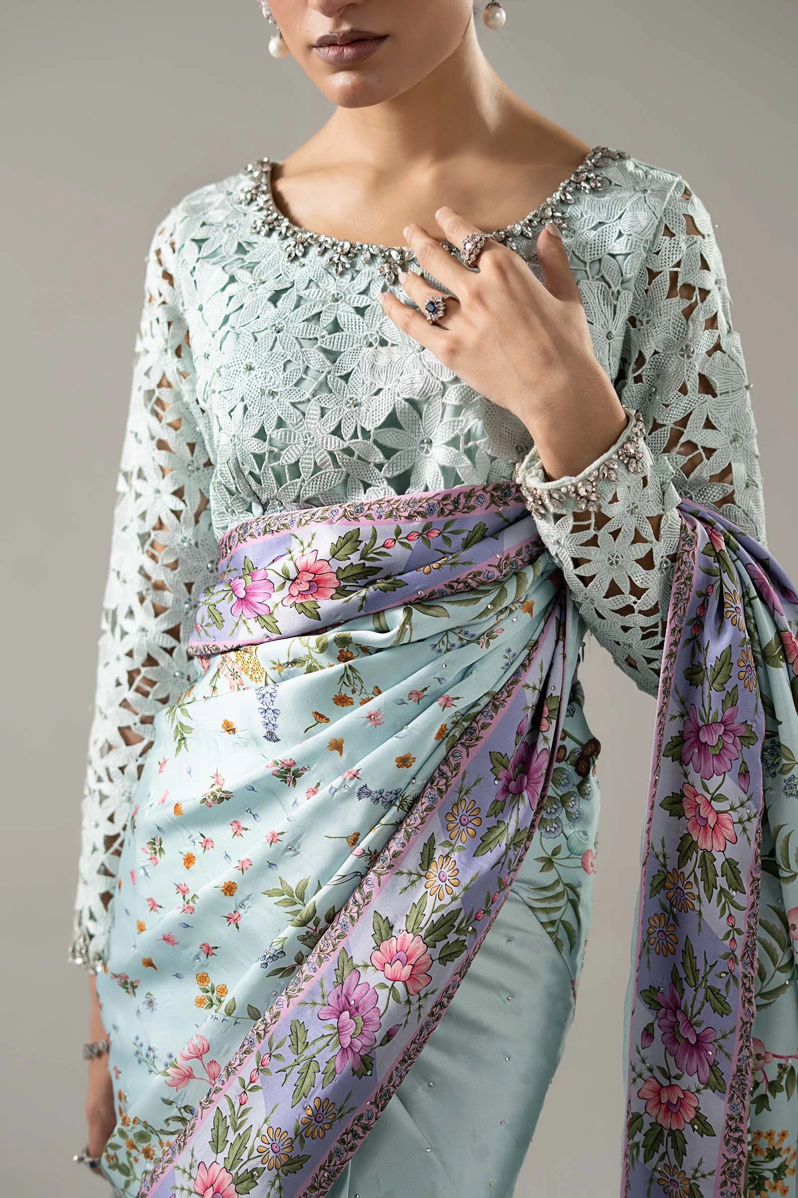 "Close-up detailing on the Maria B SF-PF26-08 Aqua blouse bodice, displaying hand-worked adda embellishments, sequin accents, and fine charmeuse silk fabric."