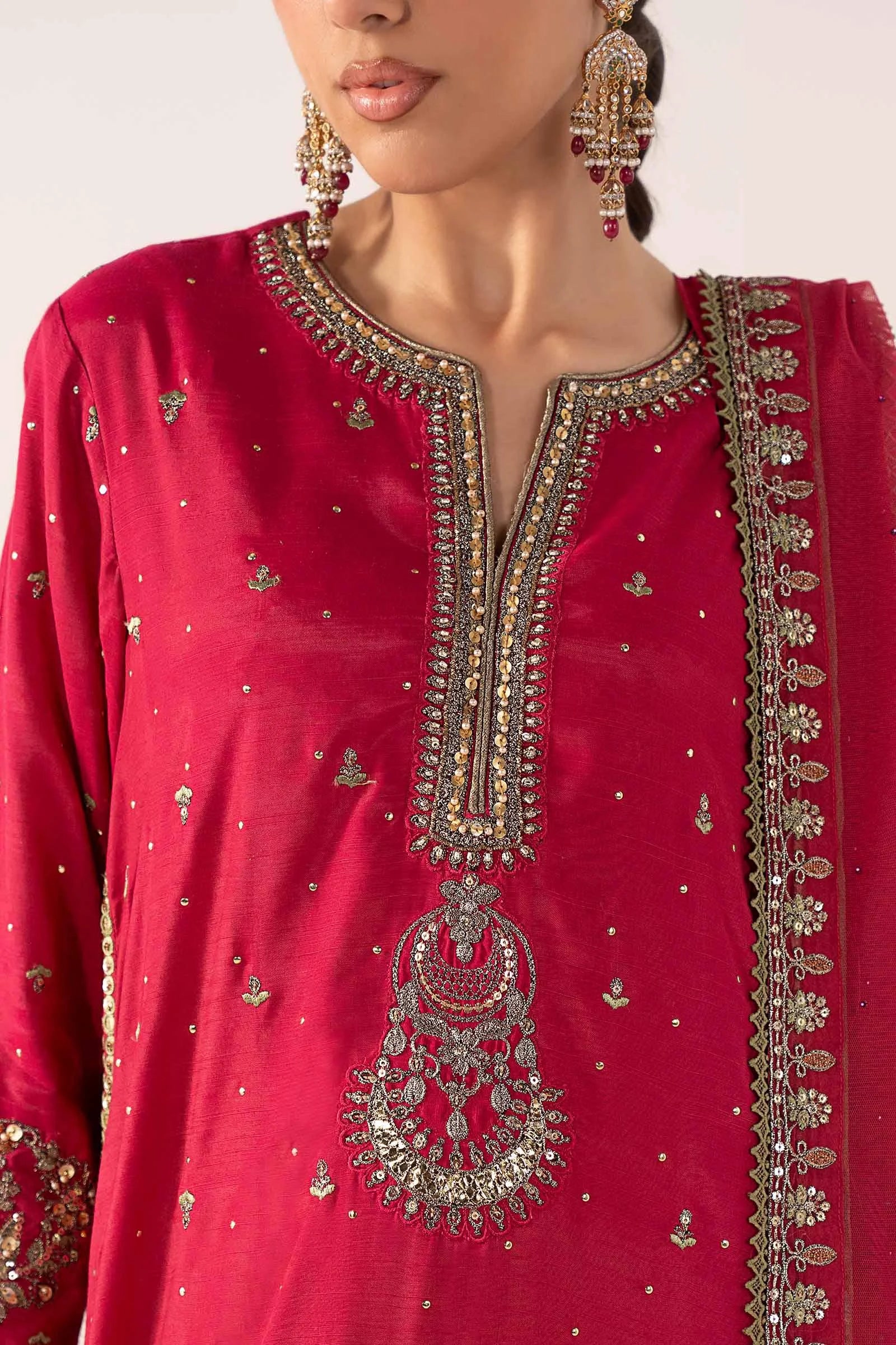 "Close-up detailing on the Maria B SF-PF26-10 Pink shirt bodice, displaying hand-worked adda embellishments, sparkling sequin accents, and fine organza fabric texture."