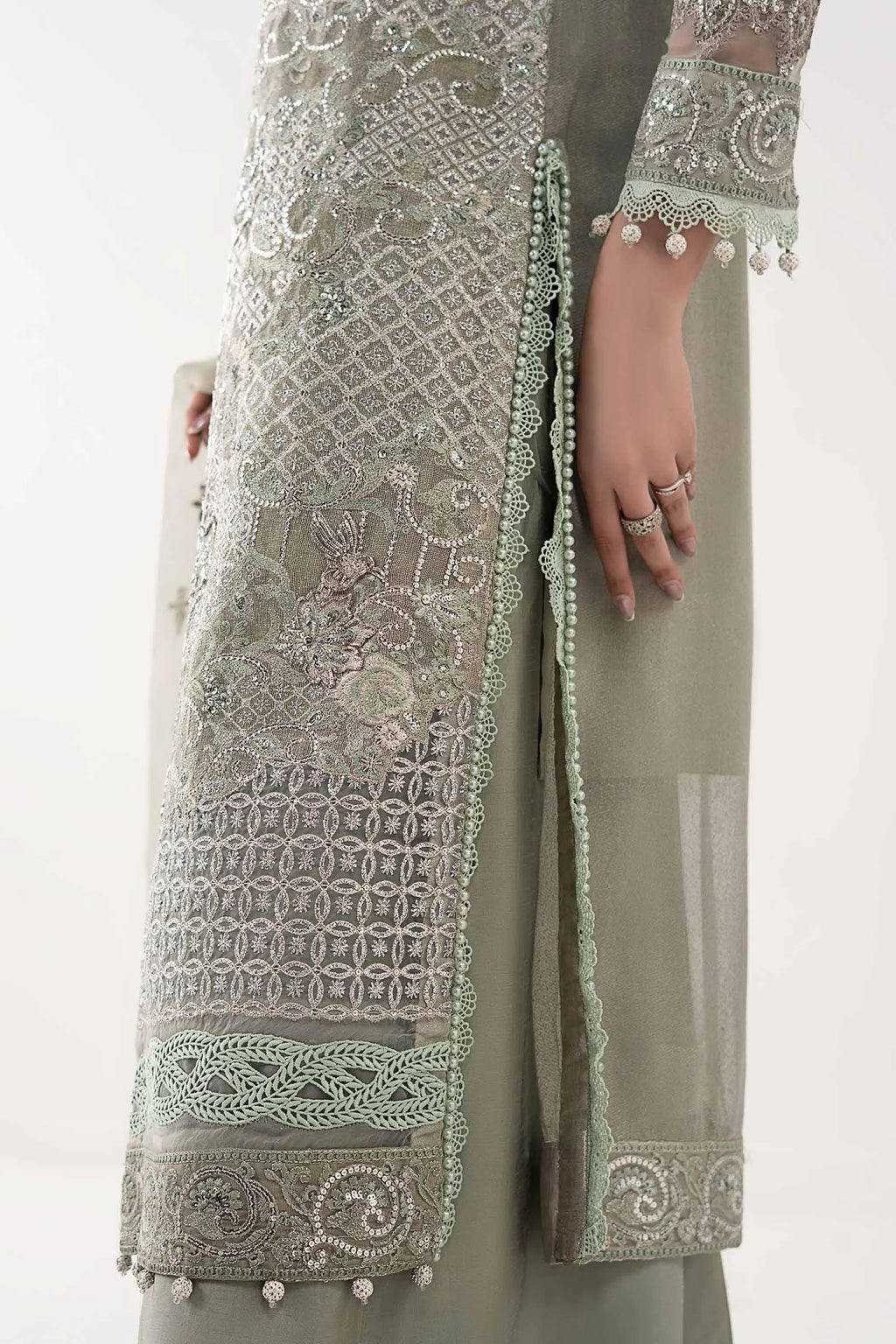 "Detailed drape view of the fluid luxury embroidered statement dupatta with scalloped borders paired with the Maria B SF-W25-24 Sea Green formal suit from Mirha Collections."