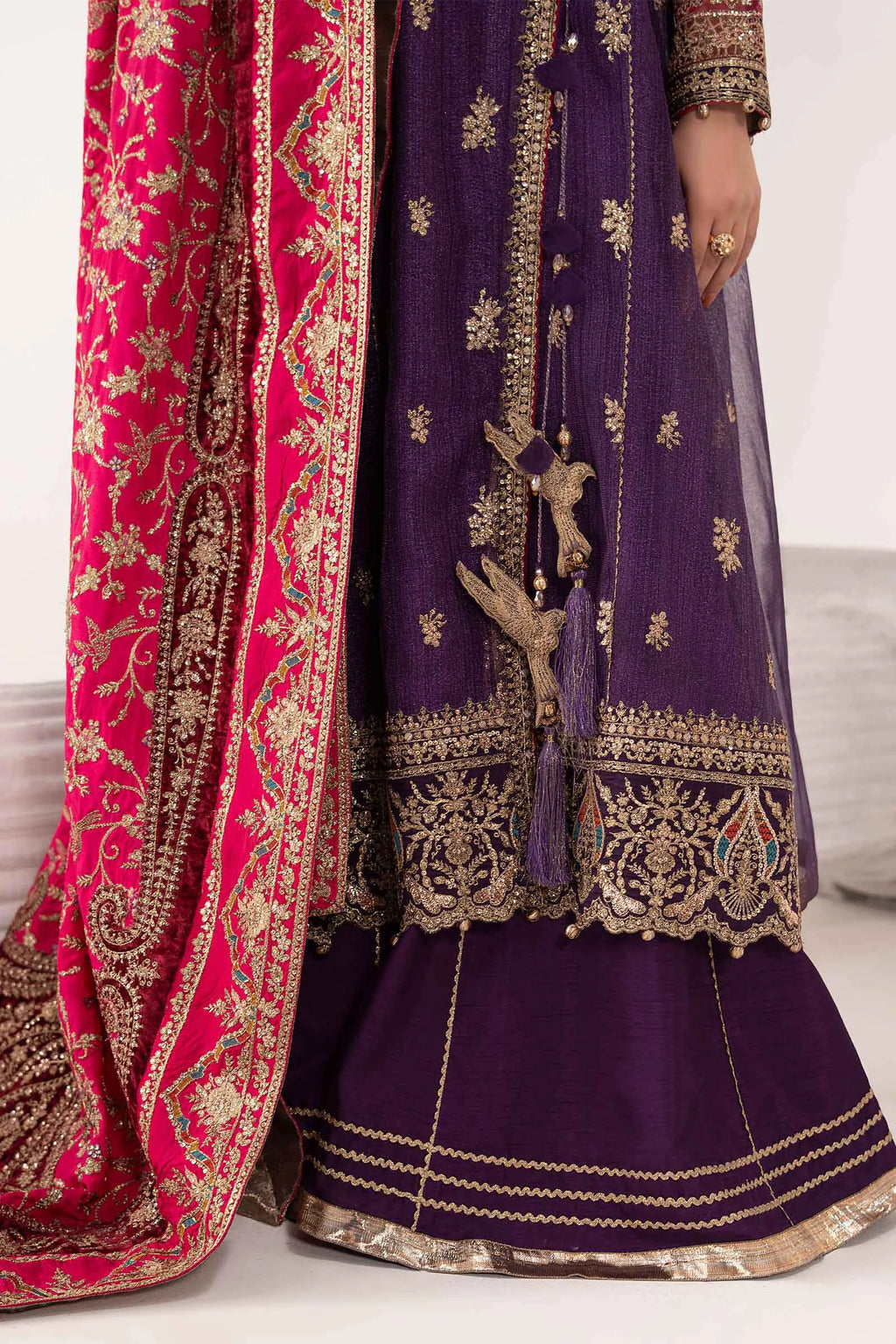 "Focus on the intricate sleeve cuff trimmings and embroidered hemline organza border details of the Maria B SF-W25-37 Purple stitched luxury suit, showing boutique-quality tailoring."