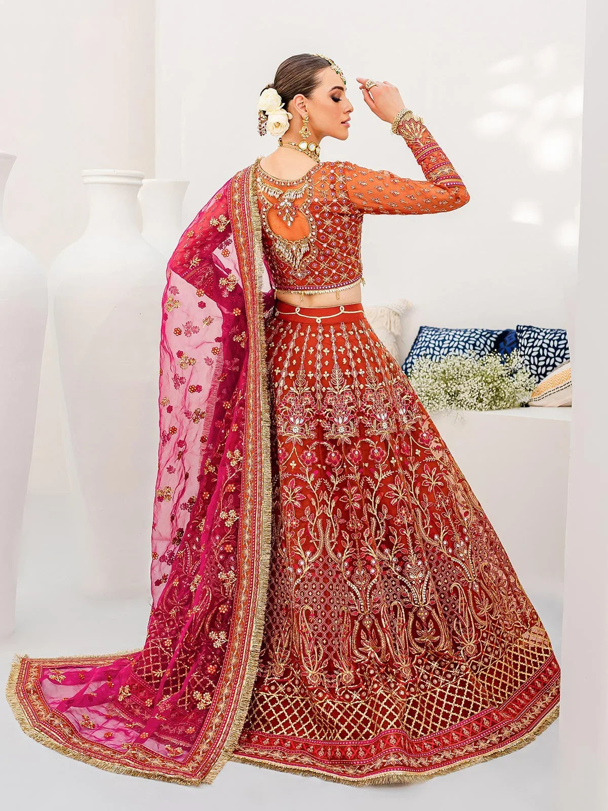 "Focus on the intricate sleeve cuff trimmings and multi-hued embroidered hemline border details of the Gulaal Satrangi 01 stitched luxury suit, showing boutique-quality tailoring."