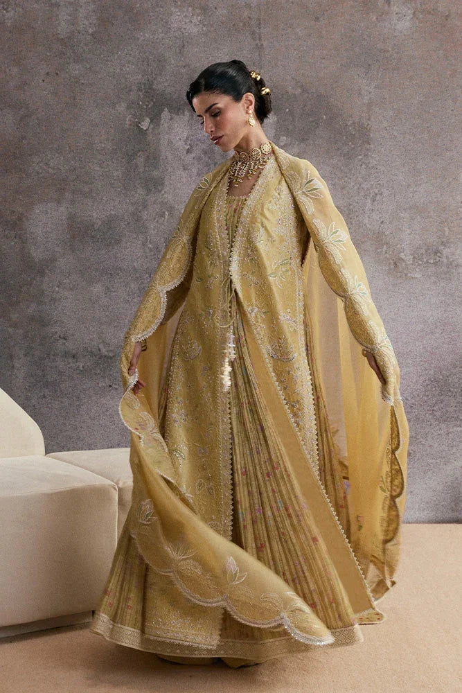"Detailed view of sleeve border trim and embroidered hemline finishings on the Suffuse Urah silk pret outfit."