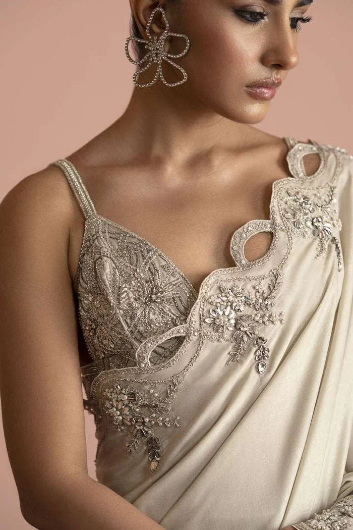 "Close-up detailing on the Vera white saree blouse featuring intricate silver zardozi embroidery and crystal hand work."