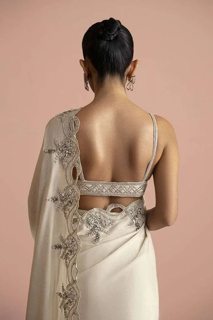 "Detailed view of the sheer shimmer organza saree pallu featuring delicate sequin borders and luminous fabric texture."