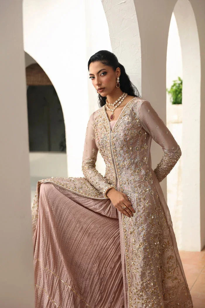 "Detailed view of intricate embroidered organza borders and cutwork daman finishings on Mysie by Tahira Yara formal suit."