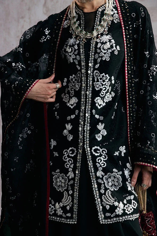 "Close-up of fine resham embroidery, pearl embellishments, and lace detailing on the Suffuse Zaarish silk shirt neckline."