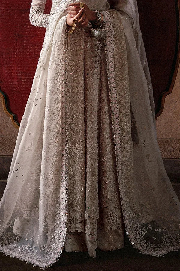 "Detailed view of intricate embroidered flared kalis and cutwork scalloped daman borders on Suffuse Zahrell formal gown."