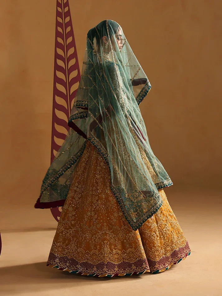 "Focus on the intricate sleeve cuff trimmings and lace hemline details of the Gulaal Zoia stitched luxury suit, showing boutique-quality tailoring."