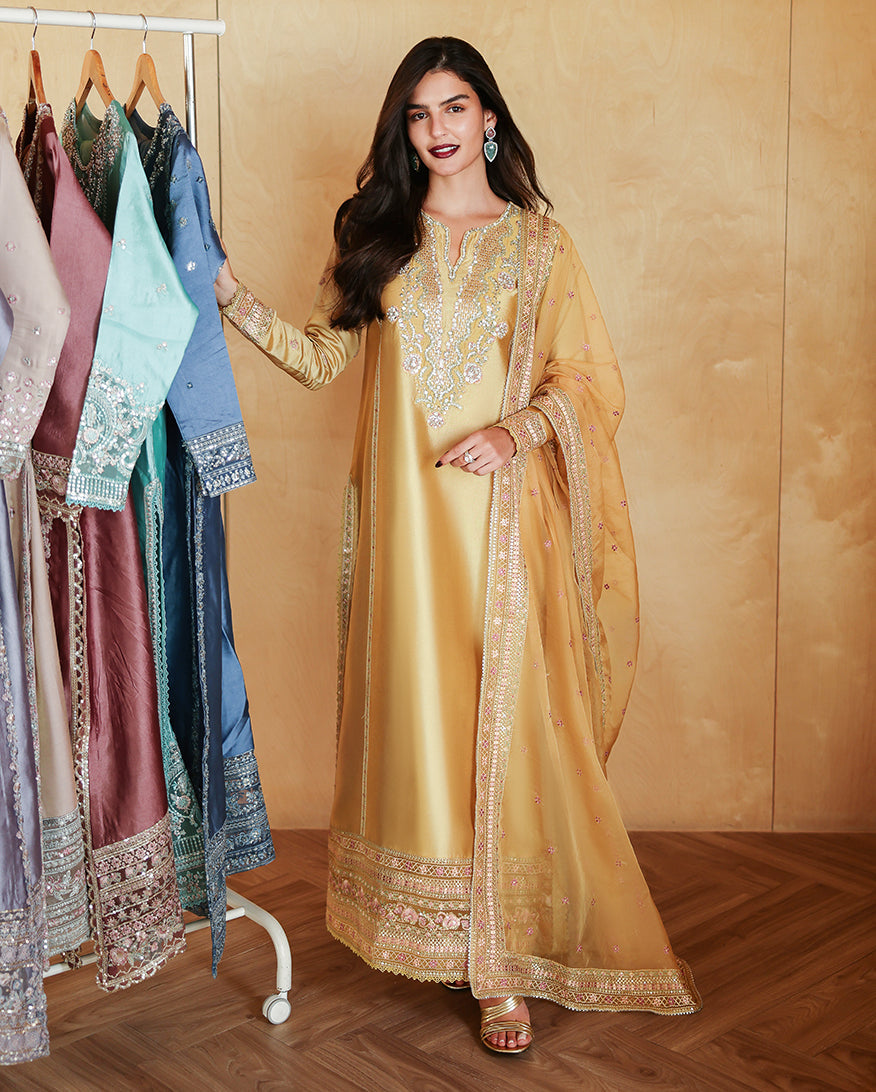 "Mirha Collections Mushq Ezel luxury embroidered stitched three-piece suit. Full-length front view featuring tailored shirt, designer dupatta, and trousers."