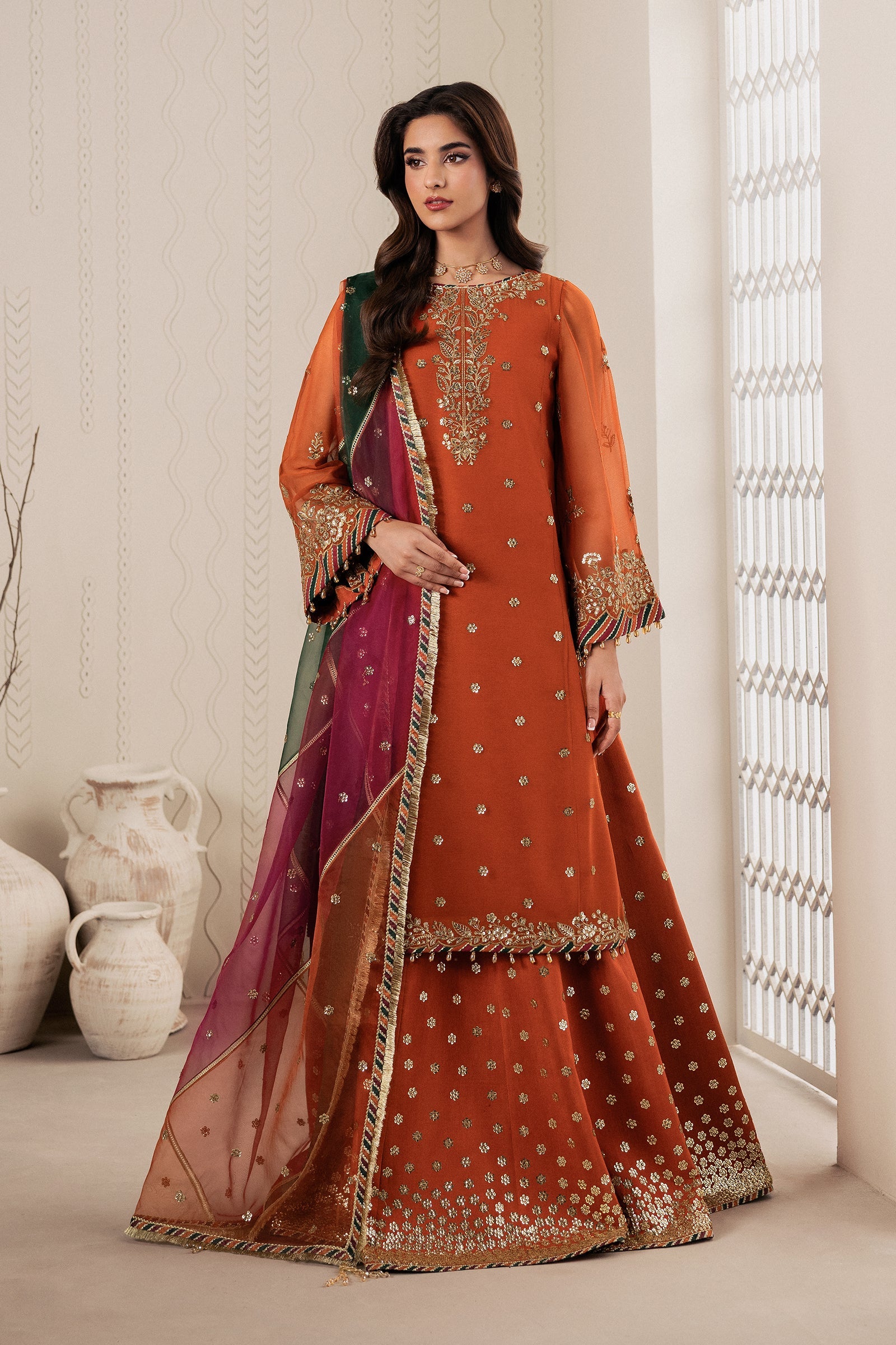 "Mirha Collections Zarif SUNOOR sequins embroidered chiffon stitched suit. Full-length front view featuring embroidered shirt, organza dupatta, and raw silk sharara."