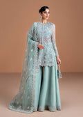 "Mirha Collections Kanwal Malik Vania luxury three-piece Pakistani designer suit. Full-length presentation showcasing an enchanting ice blue embroidered Kathan organza front-open short shirt layered over an undershirt, paired with structured flared trousers."