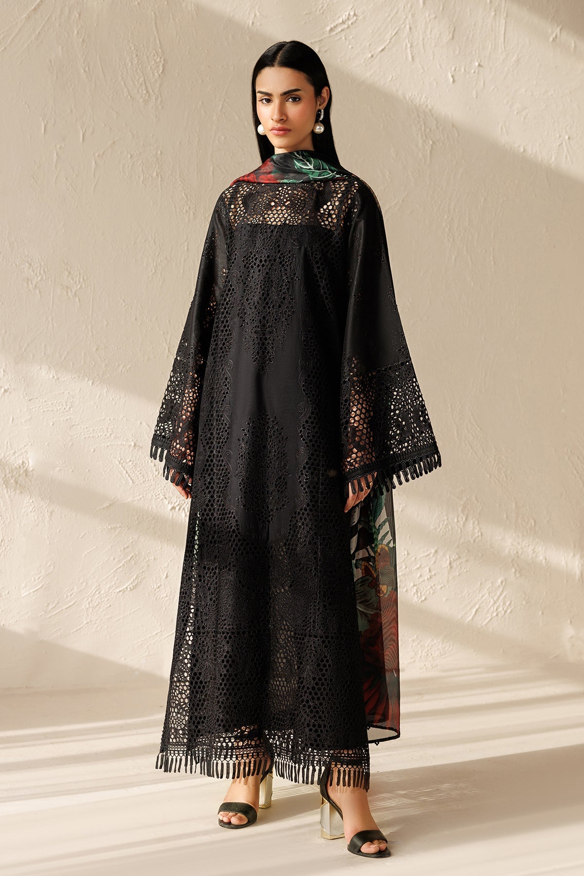 "Mirha Collections Embroidered Lawn UF-4521 luxury three-piece Pakistani designer suit. Full-length presentation showcasing an intricately embroidered lawn shirt paired with sleek tailored bottoms and a draped luxury dupatta."