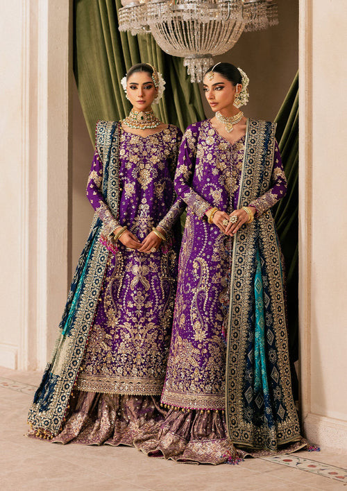 "Mirha Collections Wedding Festive Look A2601 luxury three-piece Pakistani designer suit. Full-length presentation showcasing a heavily embroidered medium silk long shirt paired with a contemporary flowing crushed sharara pants layout."