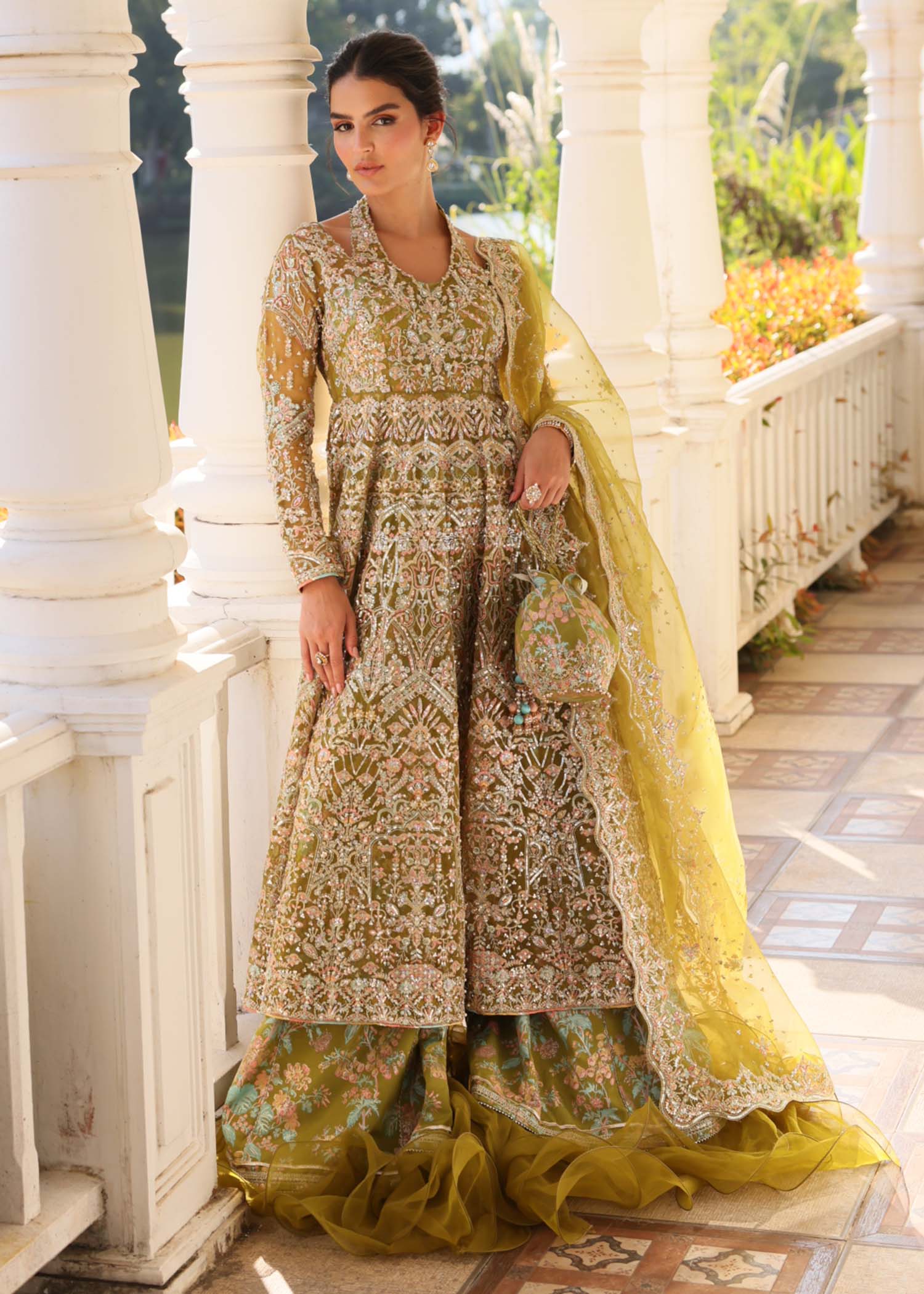 "Mirha Collections Kanwal Malik Yashma luxury three-piece Pakistani designer suit. Full-length view highlighting the premium teal raw silk straight shirt beautifully paired with matching tailored straight trousers and a coordinated luxury organza dupatta."