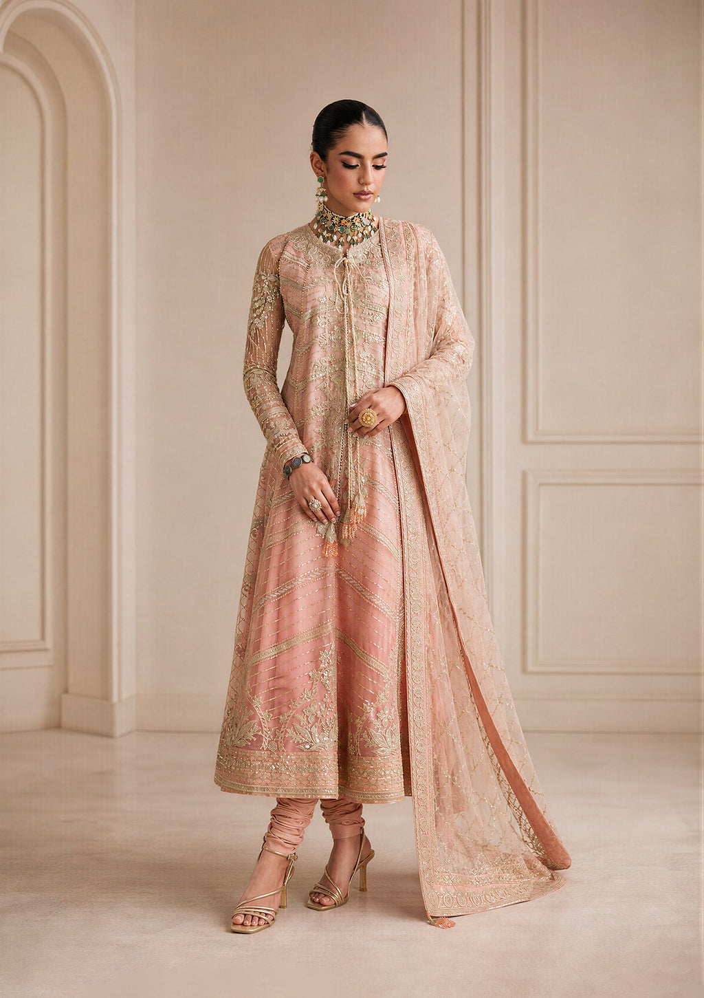 "Mirha Collections Aik Shaam Look B2605 three-piece Pakistani designer suit. Full-length presentation featuring a heavily embroidered dark evening formal shirt paired with tailored silk trousers and an embellished luxury dupatta."