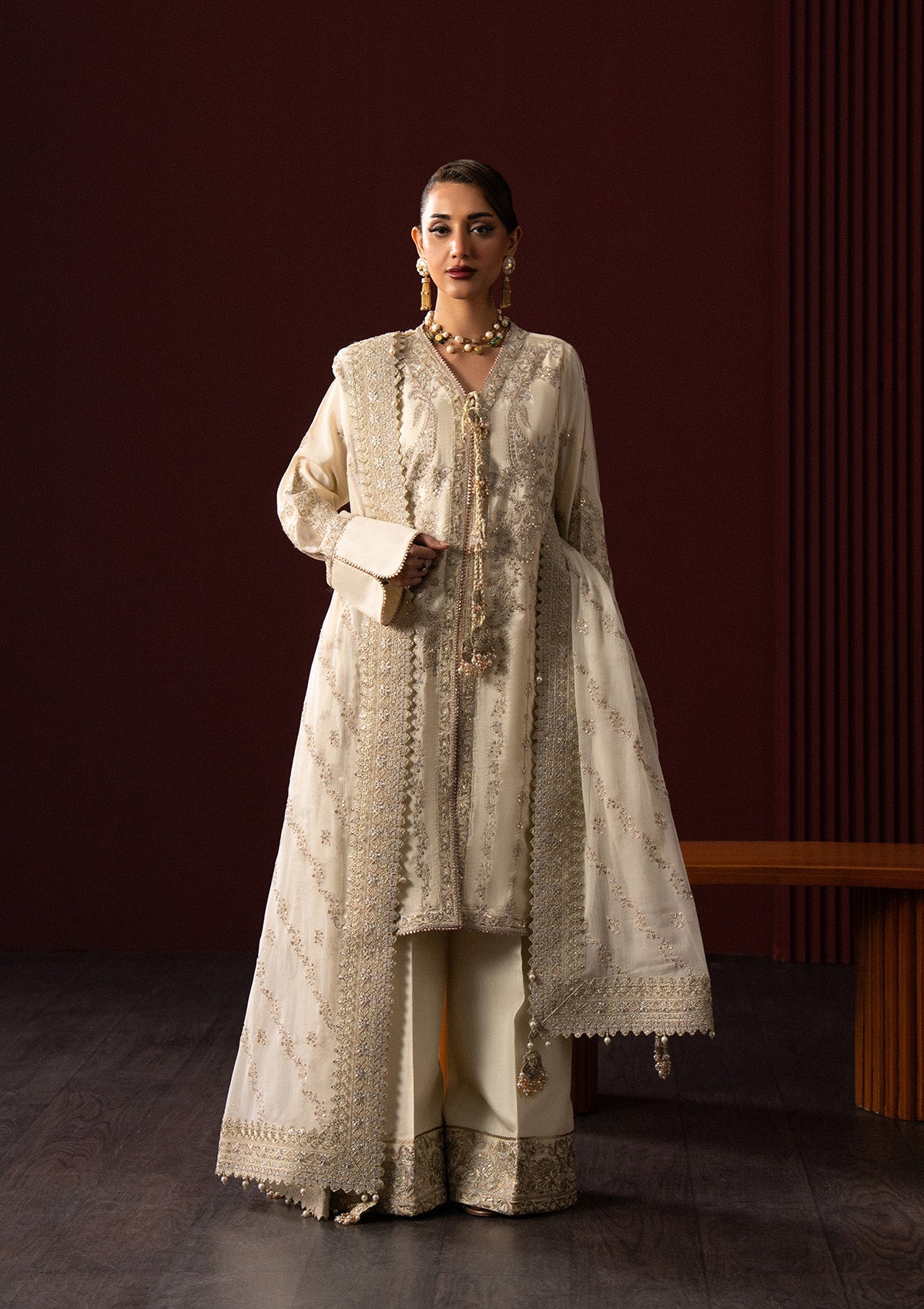 "Mirha Collections Lady Aik Look A2501 luxury three-piece Pakistani designer suit. Full-length view featuring a finely embroidered shirt paired with sleek tailored trousers and a draped luxury dupatta."