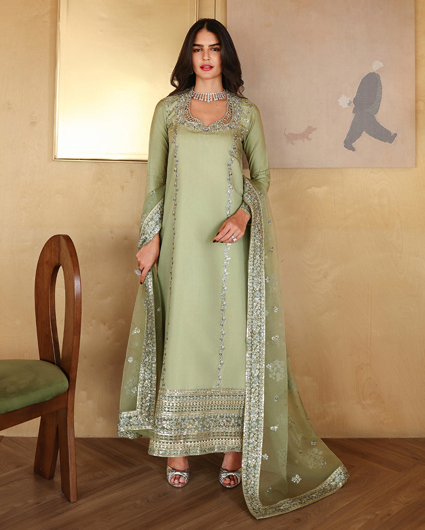"Mirha Collections Mushq Veha luxury Pista Green Sheesha Silk stitched three-piece suit. Full-length front view featuring tailored shirt, designer dupatta, and trousers."