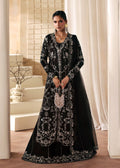 "Mirha Collections Kanwal Malik Mahsa luxury three-piece Pakistani designer suit. Full-length view highlighting a striking deep bottle green pure raw silk straight shirt paired with matching tailored trousers and a premium coordinated organza dupatta."
