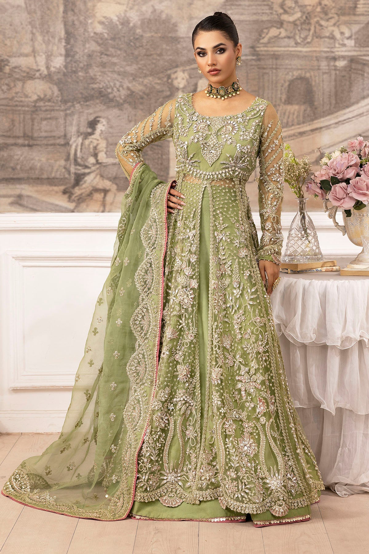 "Mirha Collections Motifz Iyara Embroidered Silk Net Unstitched three-piece luxury suit. Full-length presentation featuring an intricately embroidered silk net shirt paired with silk trousers and an embellished silk net dupatta."