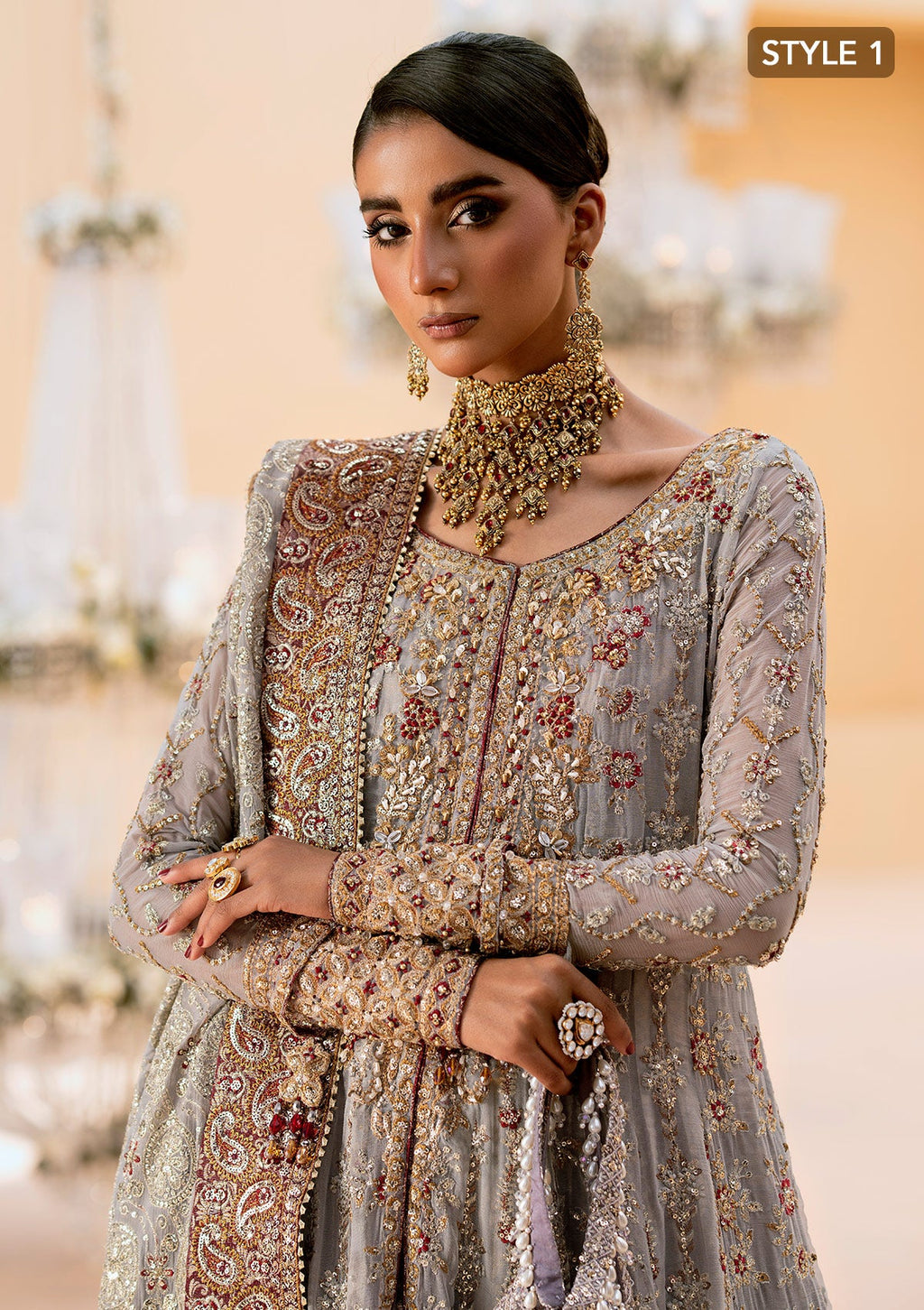 "Close-up premium craftsmanship on Aik Wedding Festive Look A2502 dress, highlighting the intricate traditional Ada hand embellishments, delicate threadwork layouts, and shimmering metallic details across the neckline."