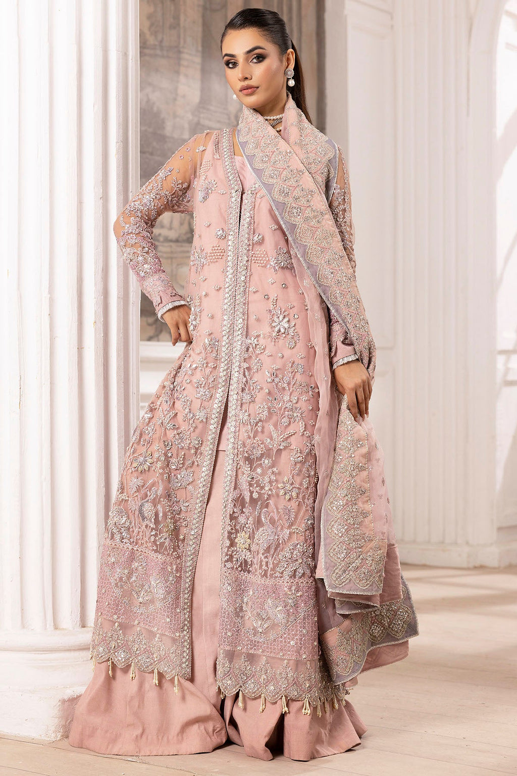 "Close-up detailing on the Motifz 4935-AHLAM silk net fabric, highlighting fine threadwork embroidery, subtle tilla accents, and delicate sequin detailing along the neckline patch."