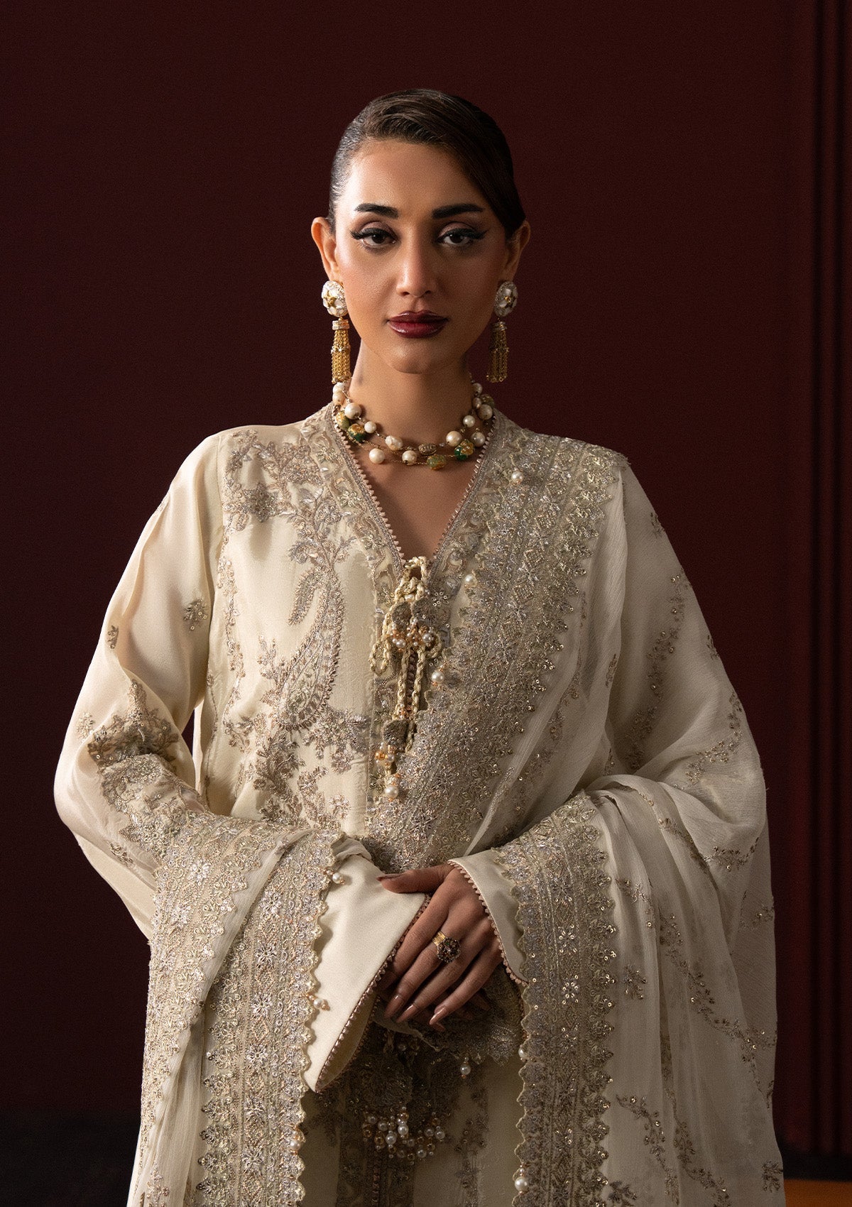 "Close-up detailing on the Lady Aik Look A2501 shirt, showcasing delicate threadwork embroidery, schiffli cutwork accents, and fine neckline finishes."