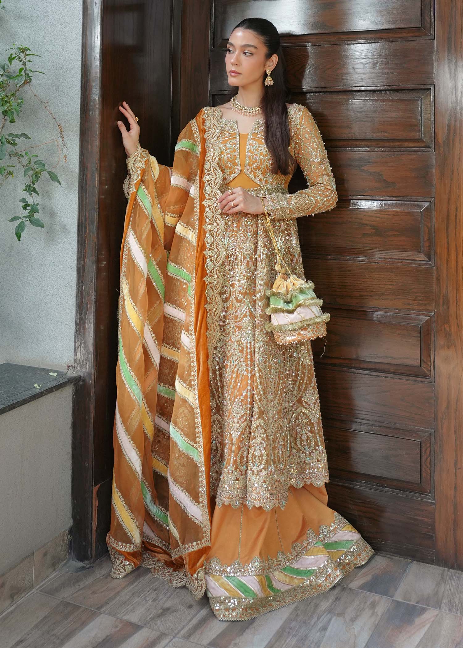 "Close-up profile of the intricately worked sleeves and lower trouser hem from the Kanwal Malik Merna ensemble, showcasing the neat lace insert panels, precise stitching layouts, and premium fabric finish."
