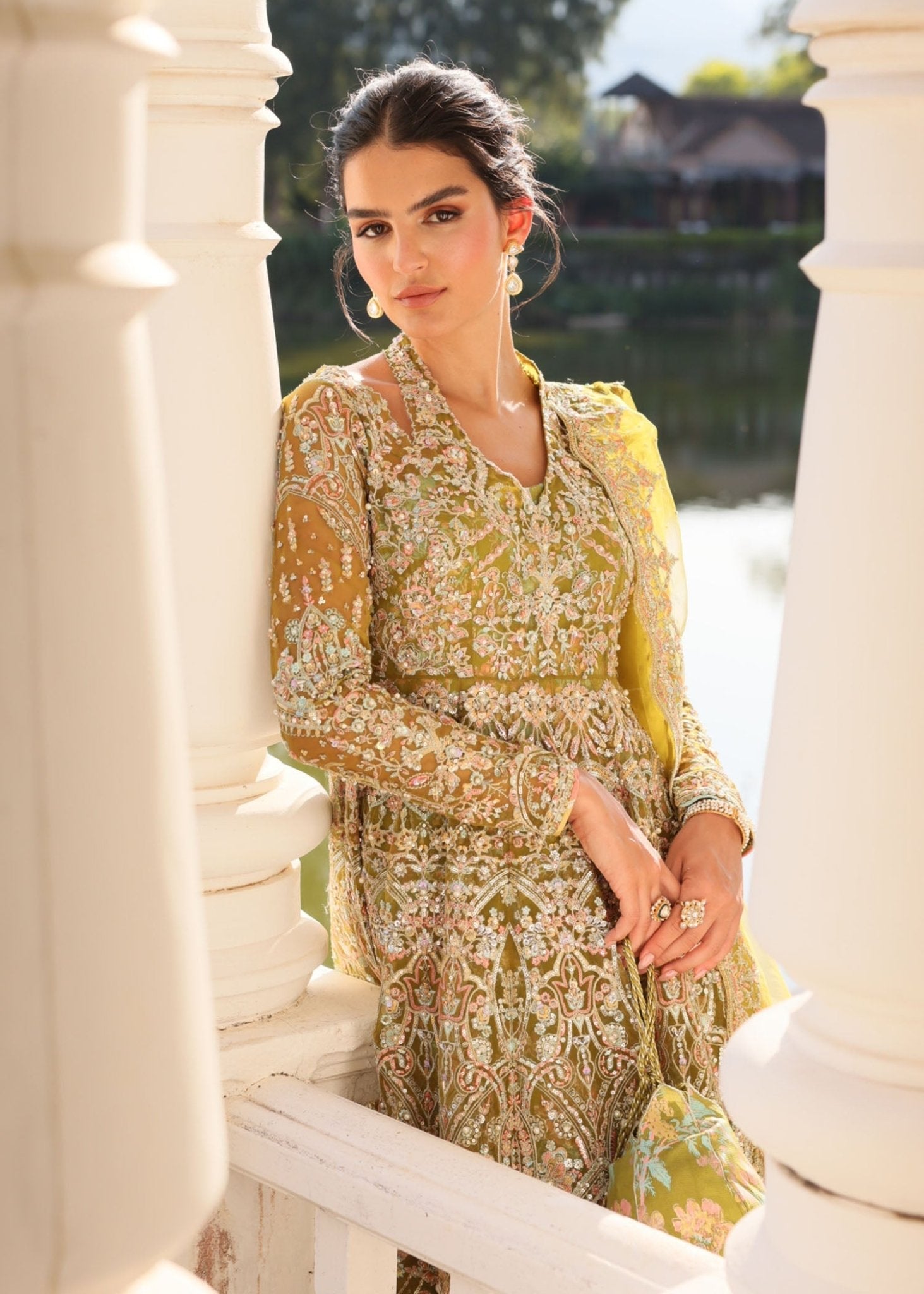 "Close-up premium craftsmanship on the Kanwal Malik Yashma silk shirt, showcasing detailed artisan Ada handwork, crystal bead placements, and shimmering fine metallic embroidery along the neckline and front panels."