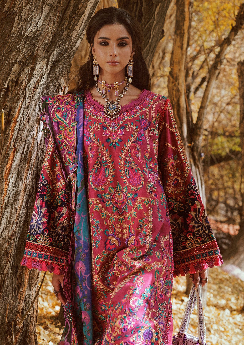 "Focus on the lower shirt hemline and sleeves of Aik Lawn Look A2609, featuring embroidered organza patch borders, neat lace trims, and tailored finishes."