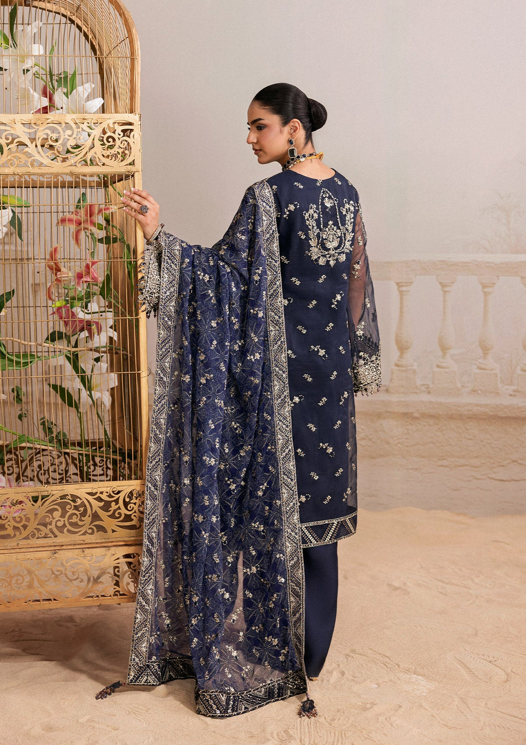 "Detailed shot of the luxury dupatta from the Aik Shaam B2604 ensemble, showcasing fine embroidery sprays and neatly finished border trims."